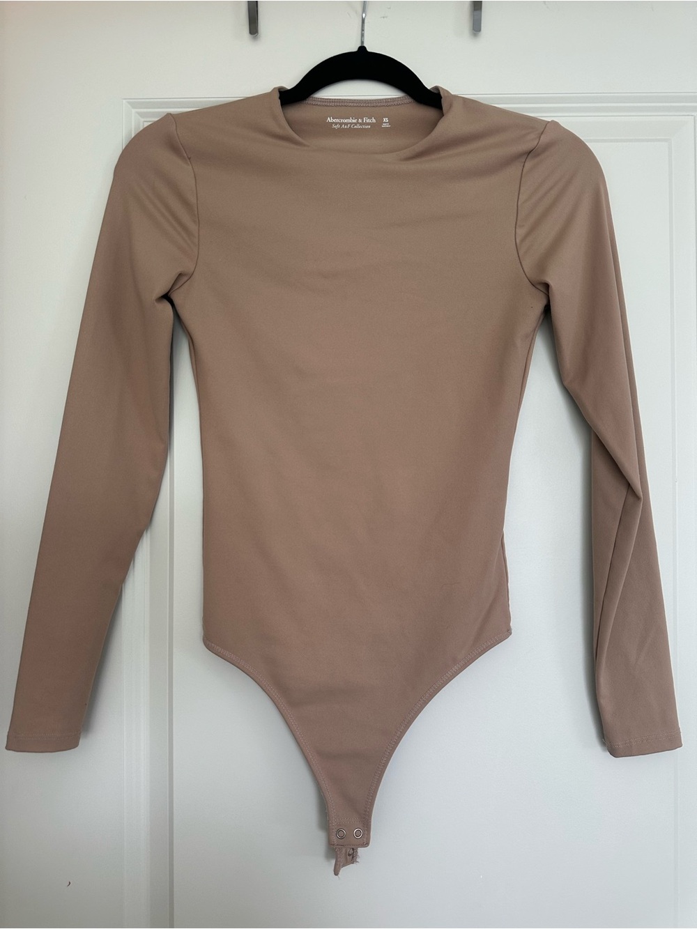 Abercrombie & Fitch Soft A&F Long Sleeve One-Piece Bodysuit in Taupe/Nude
